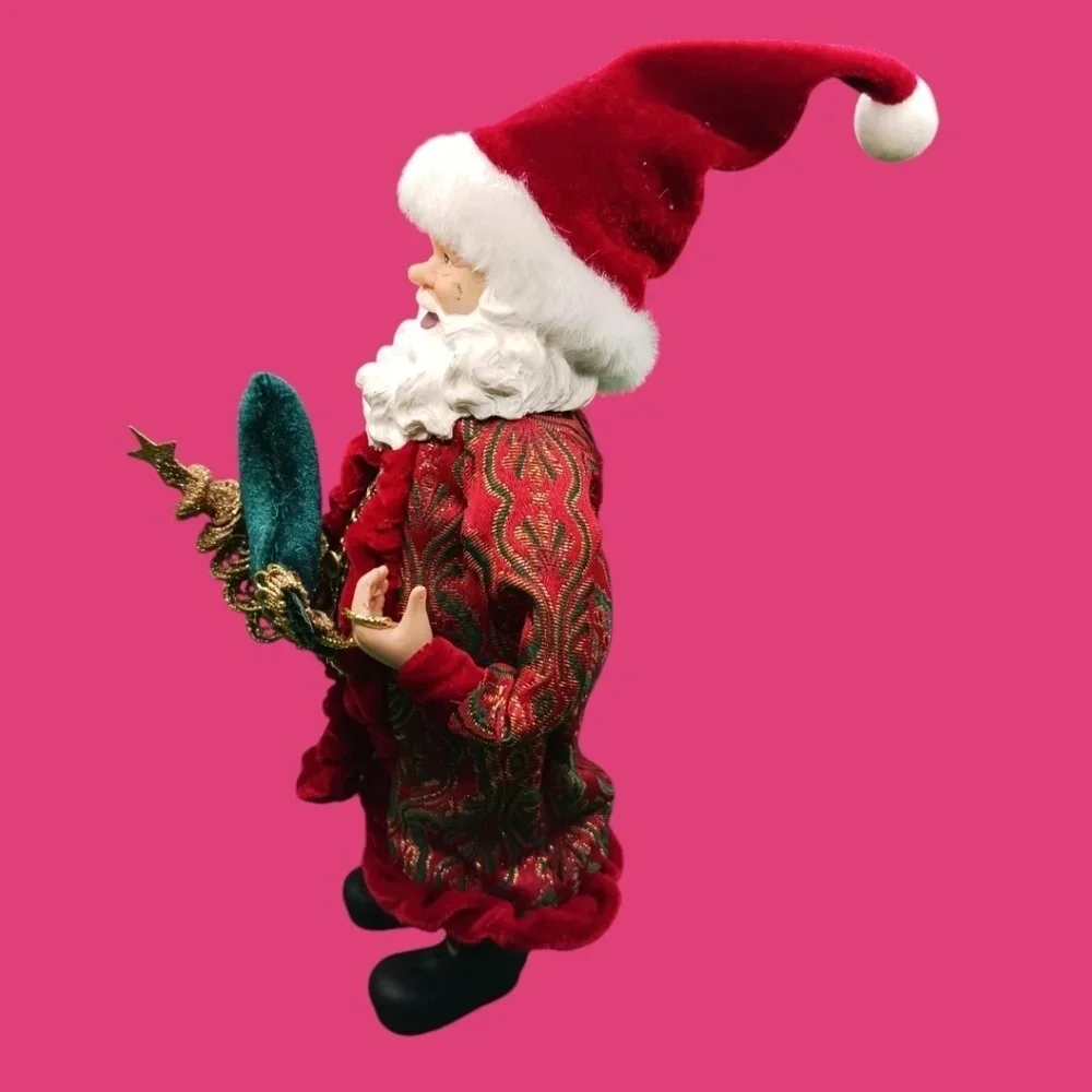 Vintage santa holding gold tree and boot